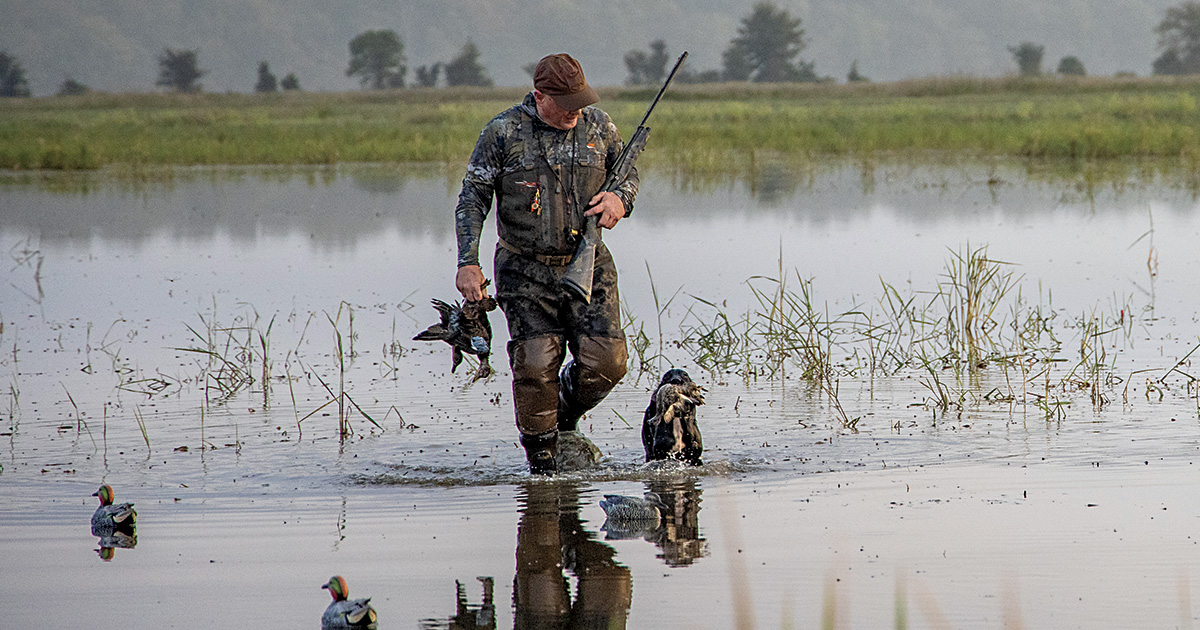 Hunter with harvested blue-winged teal. Photo by Blake Fisher/RNTcalls.com