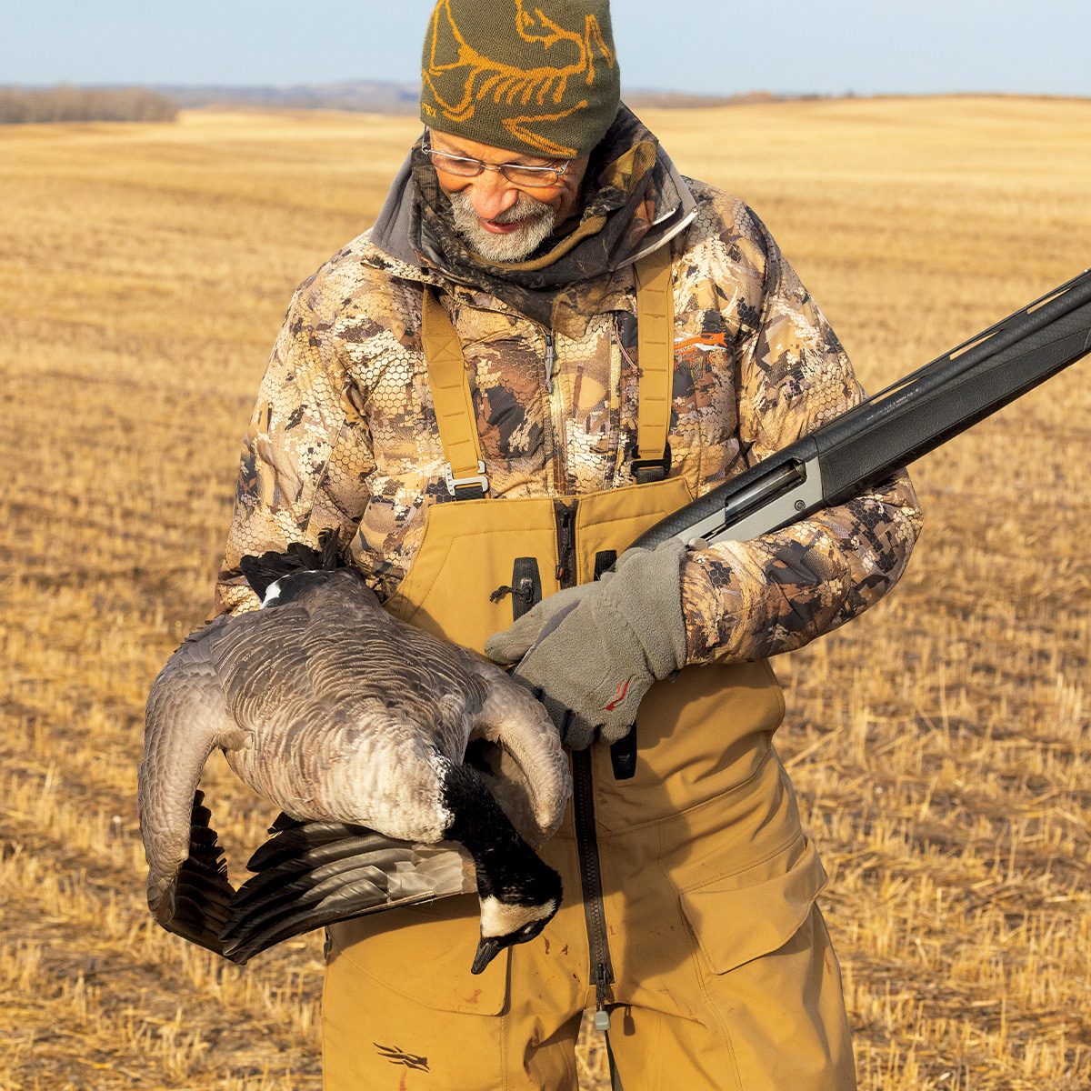 The author, Phil Bourjaily and harvested lesser Canada goose. Photo by Doug Steinke.
